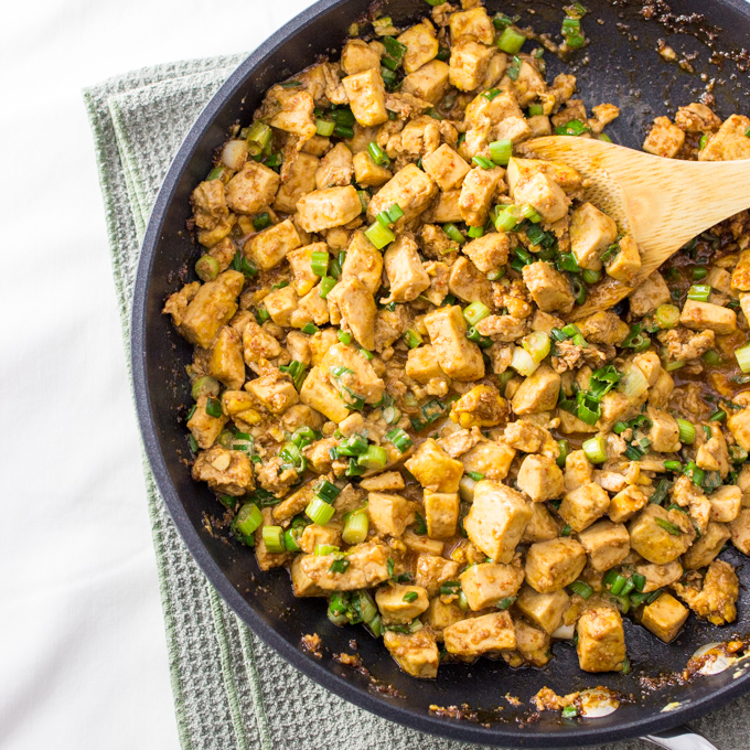 Spicy tofu skillet with eggs and scallions