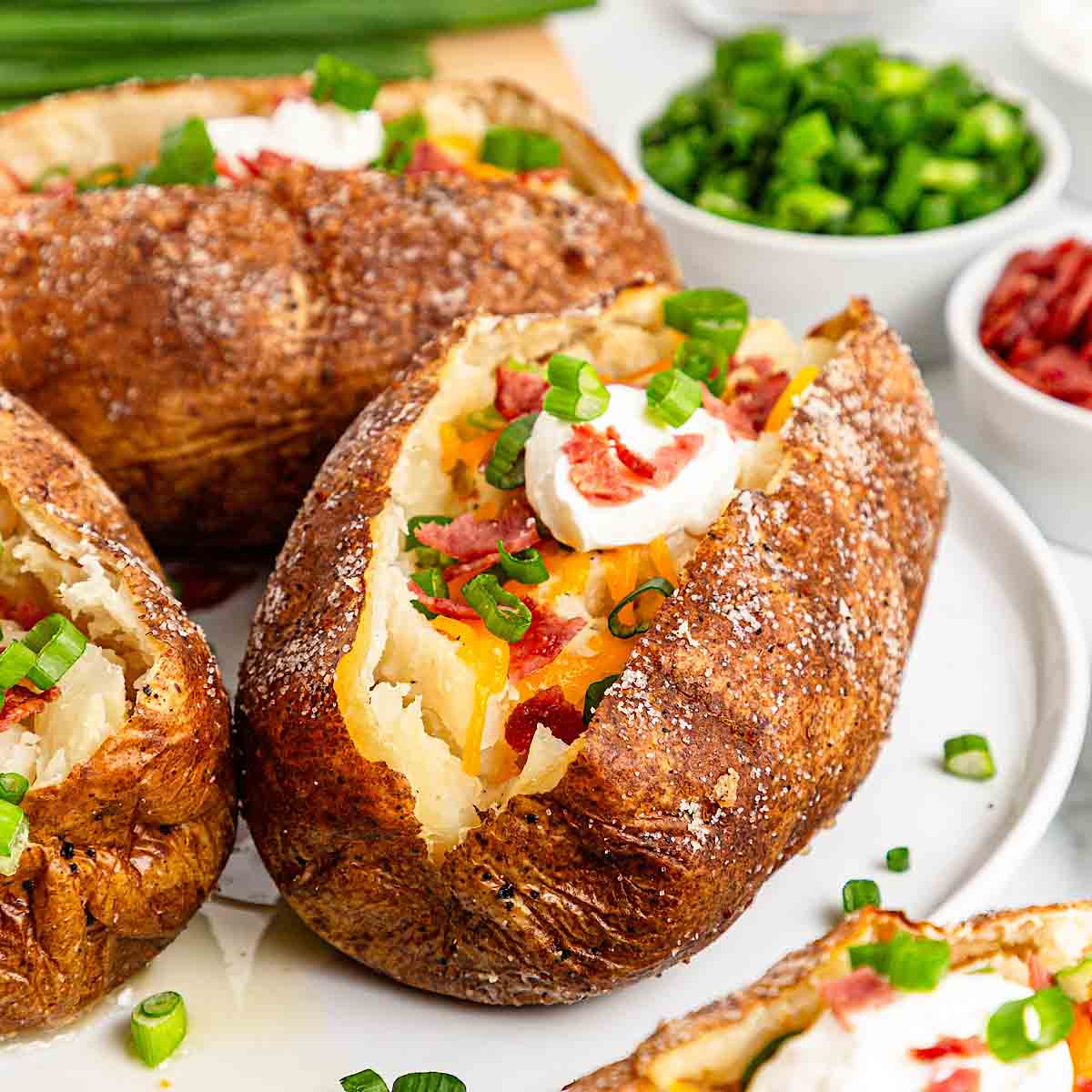 Loaded baked potatoes with bacon and cheese