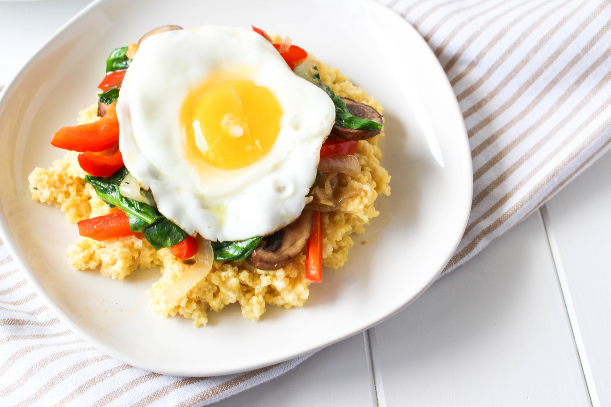 Cheesy Millet with Sautéed Vegetables and Fried Egg