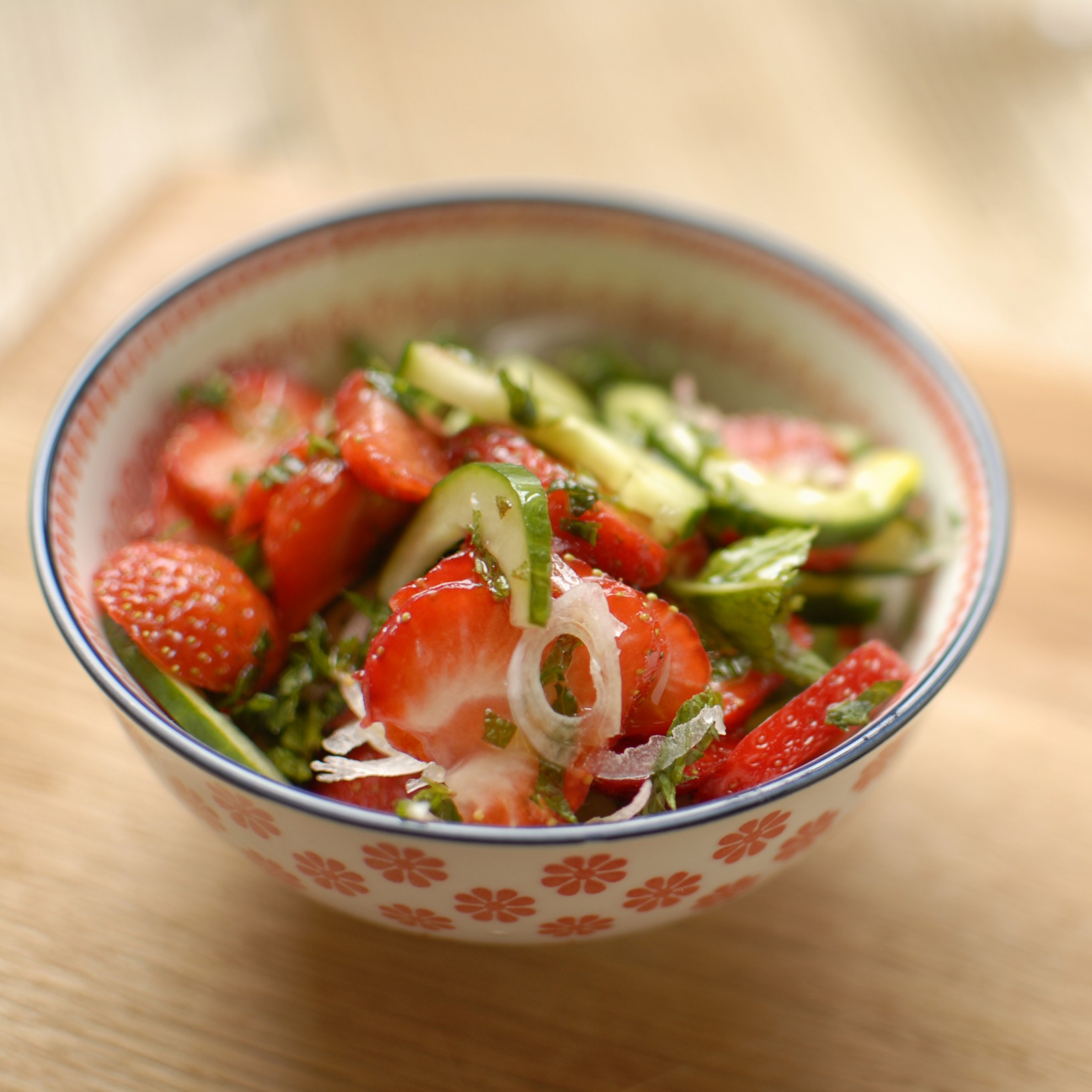 cucumber shallot and strawberry salad with mint and passionfruit dressing