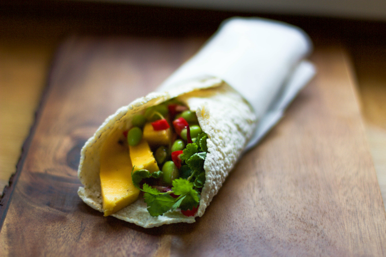 Gluten-free tortilla wrap with mango and edamame beans