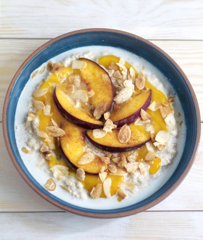 Coconut Porridge with Mango Puree Peach and Toasted Almonds
