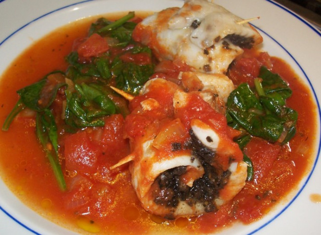 Fish stuffed with spinach olives and Tomatoes