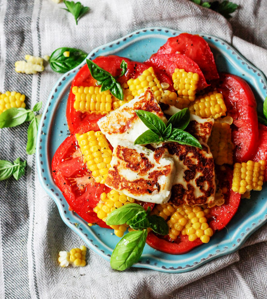 fried halloumi cheese with corn and tomatoes