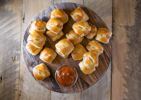 Mini pork, apple & sage sausage rolls with curry ketchup