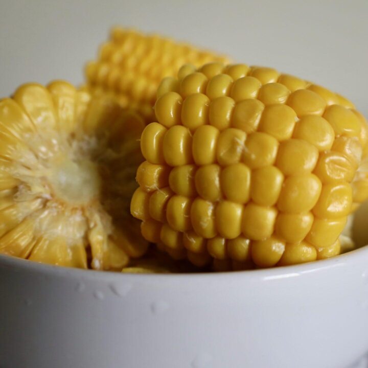 Boiling corn on the cob in milk and butter